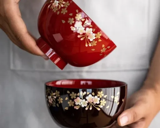 someone hold 2 sakuru bowls 