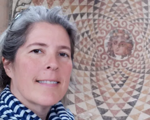 A woman with grey hair.