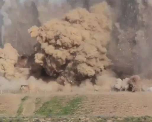 bomb going off in desert.
