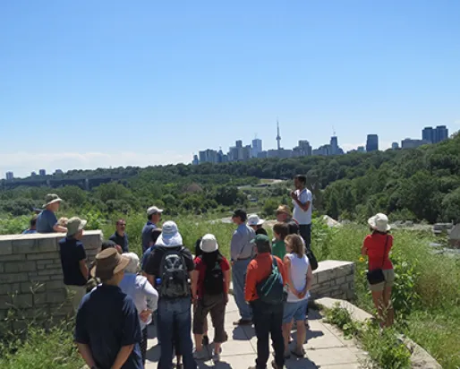 Group stands with Toronto skyline in Background
