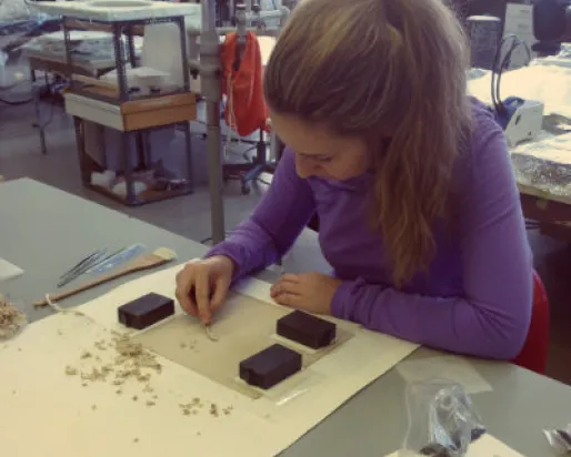 Natasa performing backing removal on an albumen photograph at her bench in the Queen’s conservation lab. Photo courtesy of Natasa Krsmanovic.
