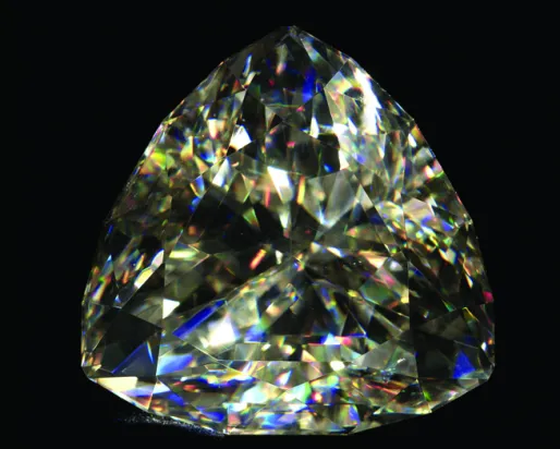 A diamond like gemstone on a black background
