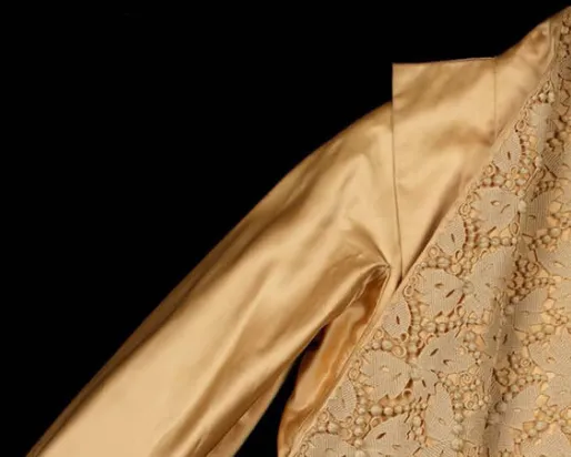 Dior jacket on black background.
