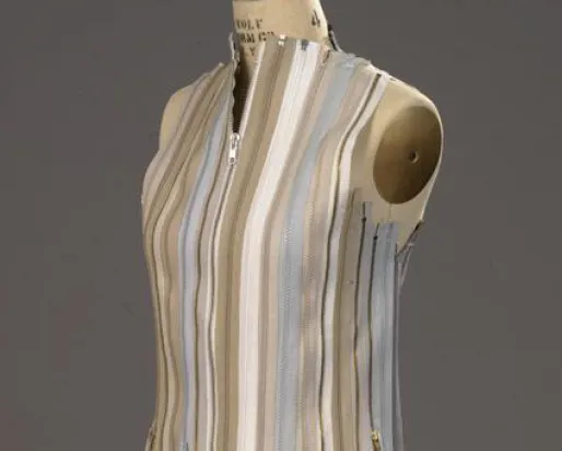 Vest made of neutral colour zippers.
