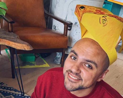 Kiron Mukherjee wearing parasaurolophus headdress.
