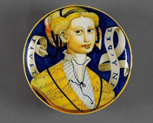 Italian pottery plate with a woman painted on it.