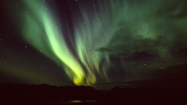 The Northern Lights over Fish Lake near Whitehorse, Yukon Territory. Photo by Anthony DeLorenzo via Wikimedia Commons
