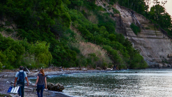 Dr. Burton Lim (left) and ROM Biodiversity's Nicole Richards (right) walk along the Scarborough Bluffs waterfront en route to one of the three bat detectors. Photo by Filip Szafirowski