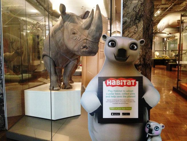 Polar bear characters from Habitat the Game stand next to Bull the Southern white rhino in the Schad Gallery