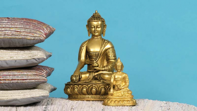 Large and small brass seated Buddha statues.