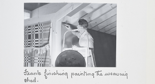 "Frank finishing painting the weaving shed."