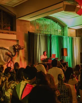 A dj performing at a museum.