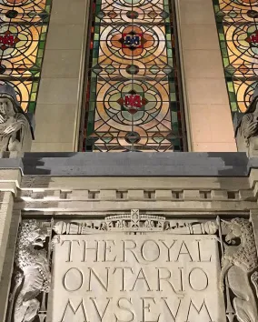 Image of the exterior Queen's Park entrance stained glass windows and architecture