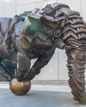 Artwork with figure balanced on a ball