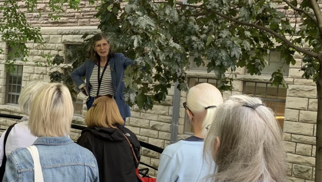 Deborah Metsger talking to program participants about trees in Ontario.