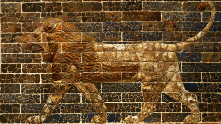 Mosaic depicts a Lion walking in profile.