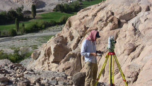 A man maps the archaeological site.