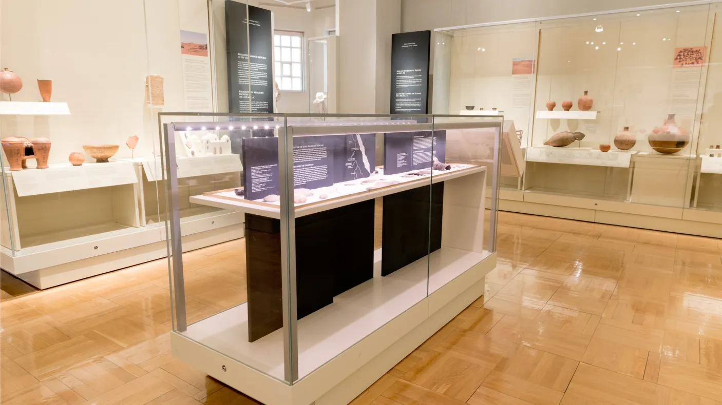 A gallery displaying a collection of African objects including pottery.