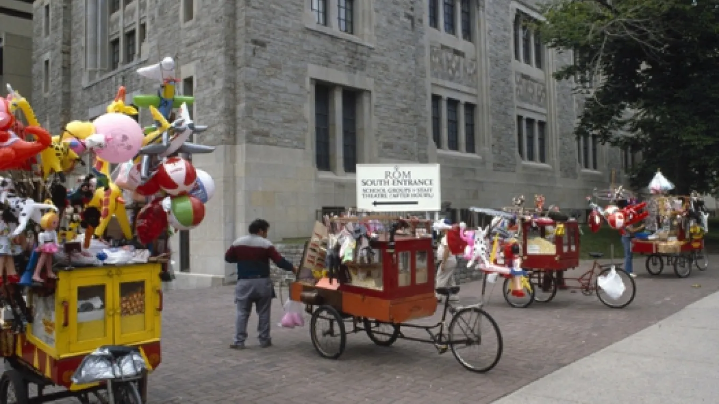 A popcorn cart in the middle of the street.