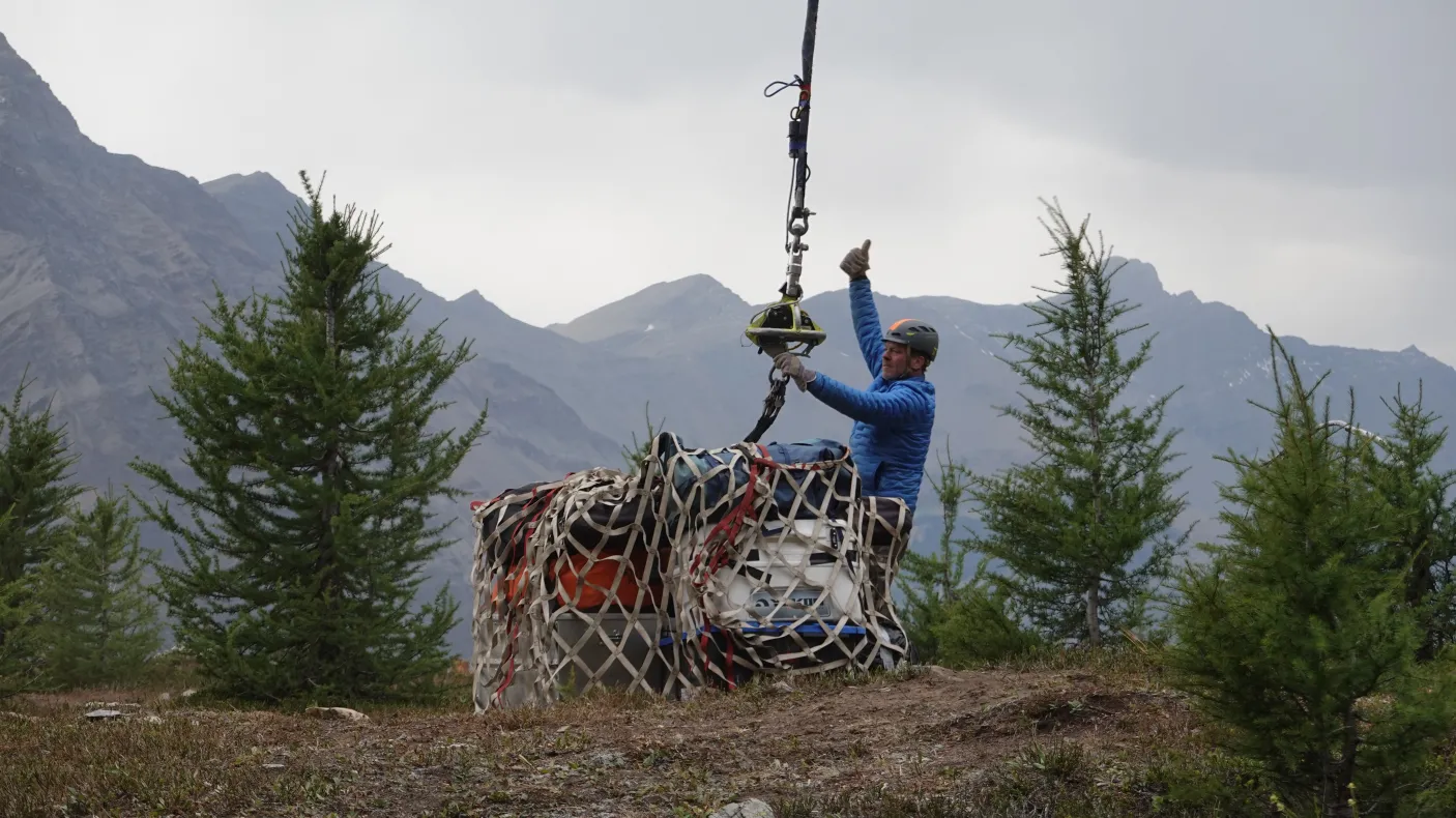 Large fossil being moved by helicopter.