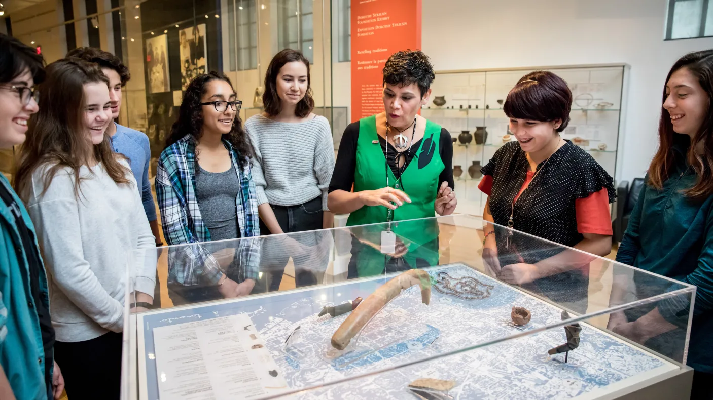 Instructor explaining collection item to students