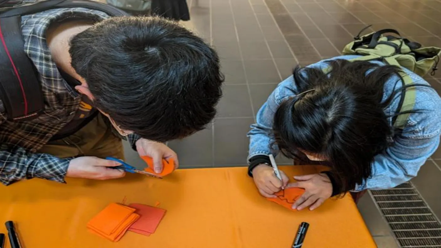 2 students doing arts and crafts