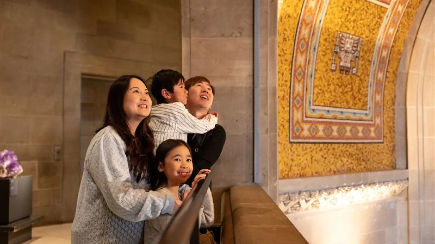 Family looking up at the Rotunda ceiling. 