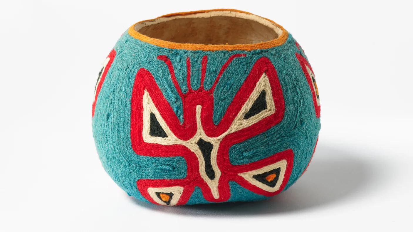 A decorated gourd made by a Huichol artist