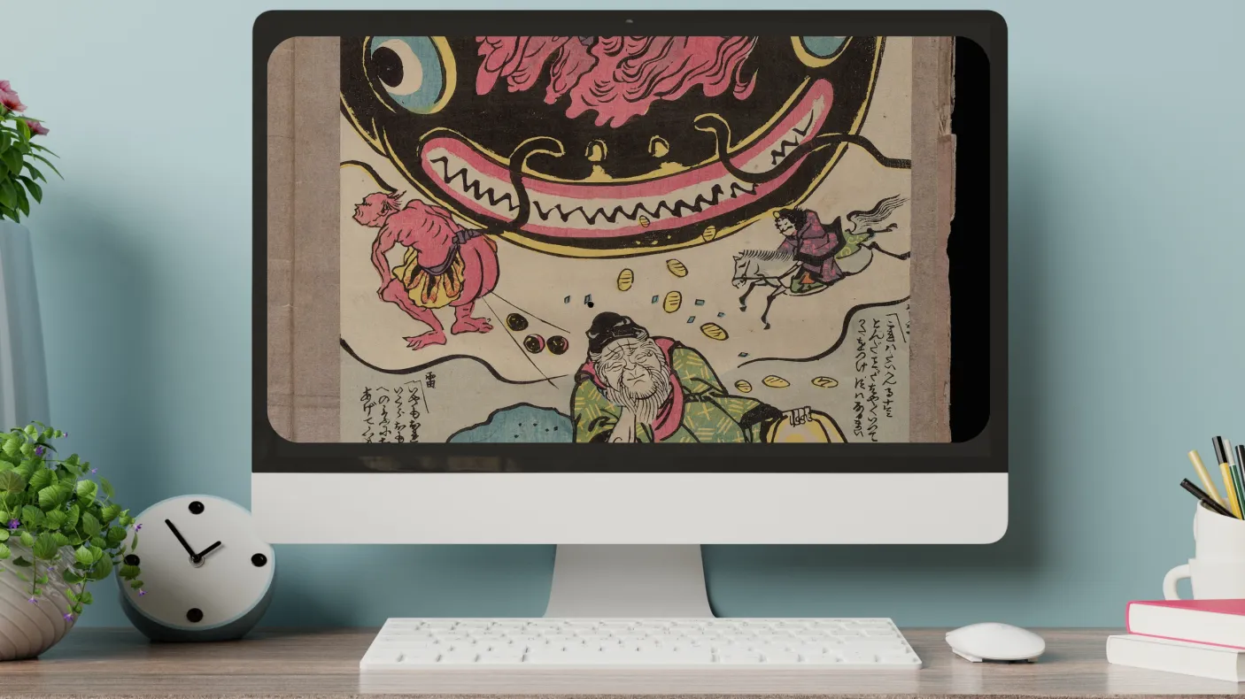 A desktop monitor displays a print of a giant koi