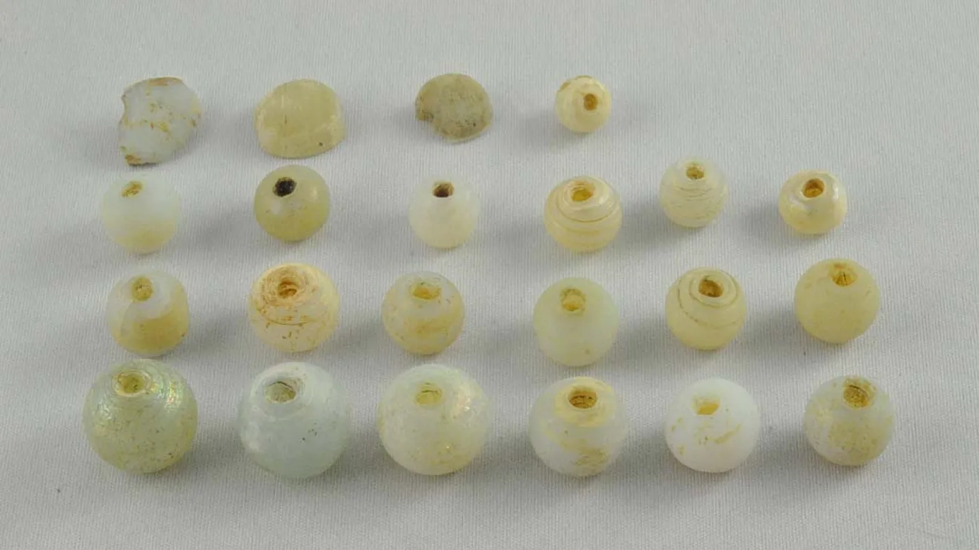 four rows of white sead beads
