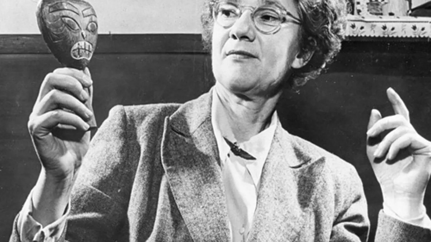 Ella Martin displays an artifact.