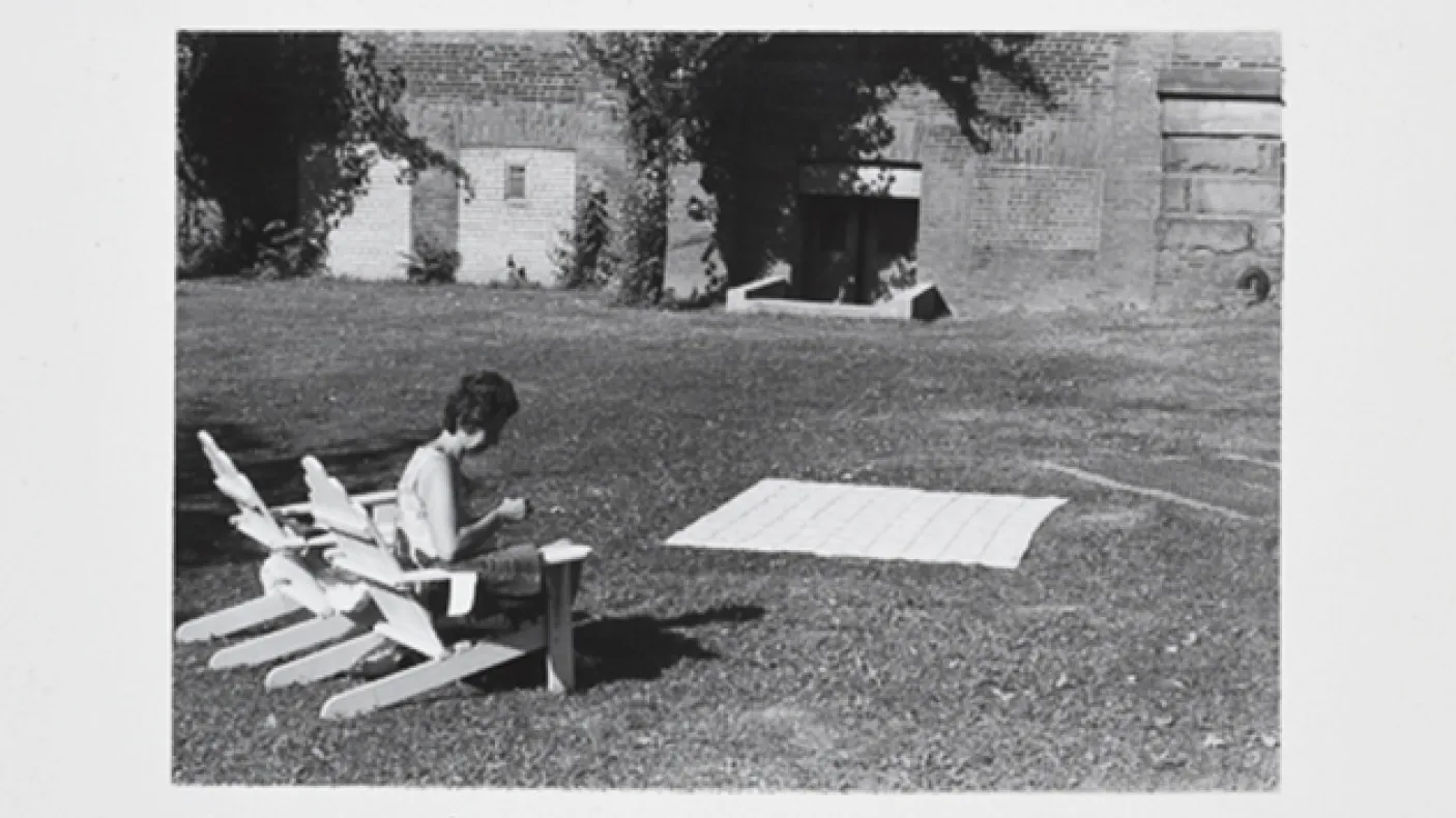 Judy drying a coverlet in the ROM garden
