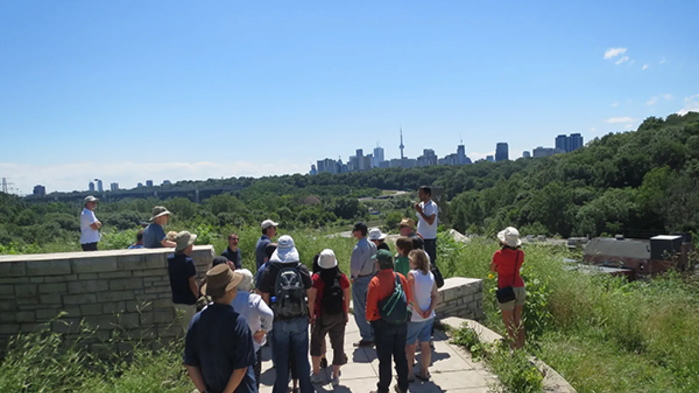 Group stands with Toronto skyline in Background
