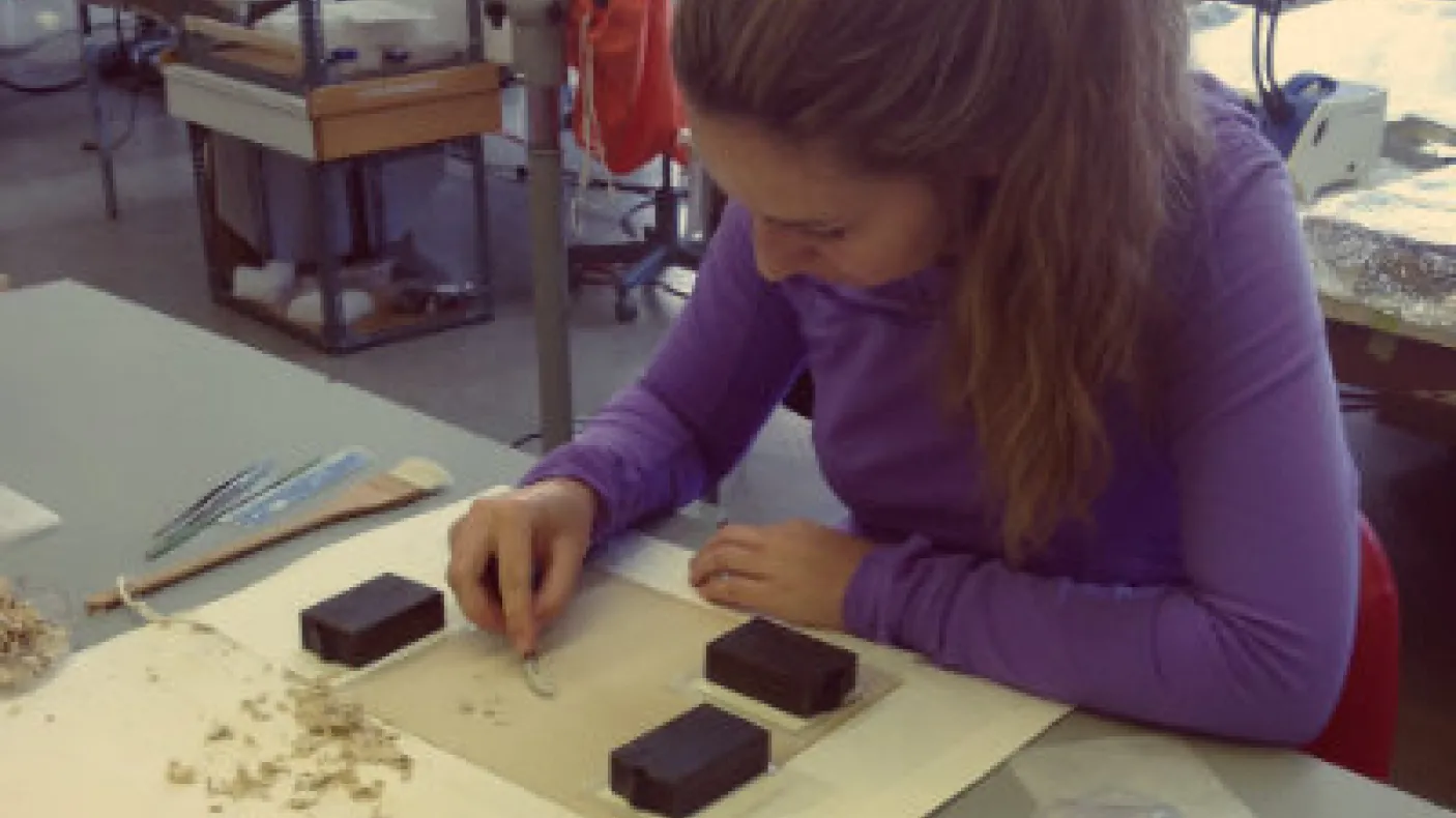 Natasa performing backing removal on an albumen photograph at her bench in the Queen’s conservation lab. Photo courtesy of Natasa Krsmanovic.
