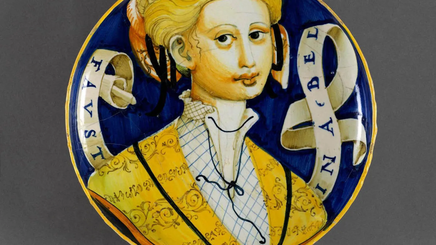 Italian pottery plate with a woman painted on it.