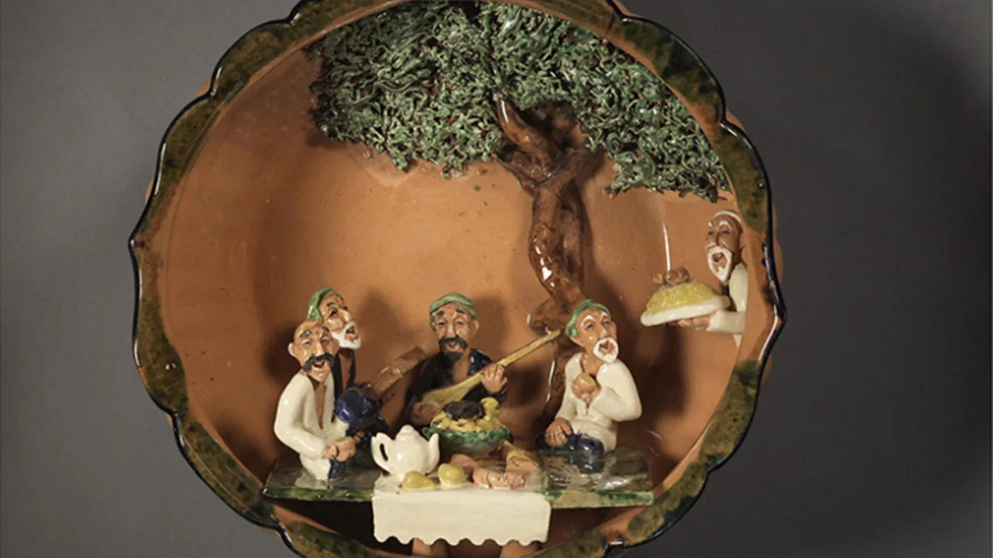Earthenware bowl with moulded figures.