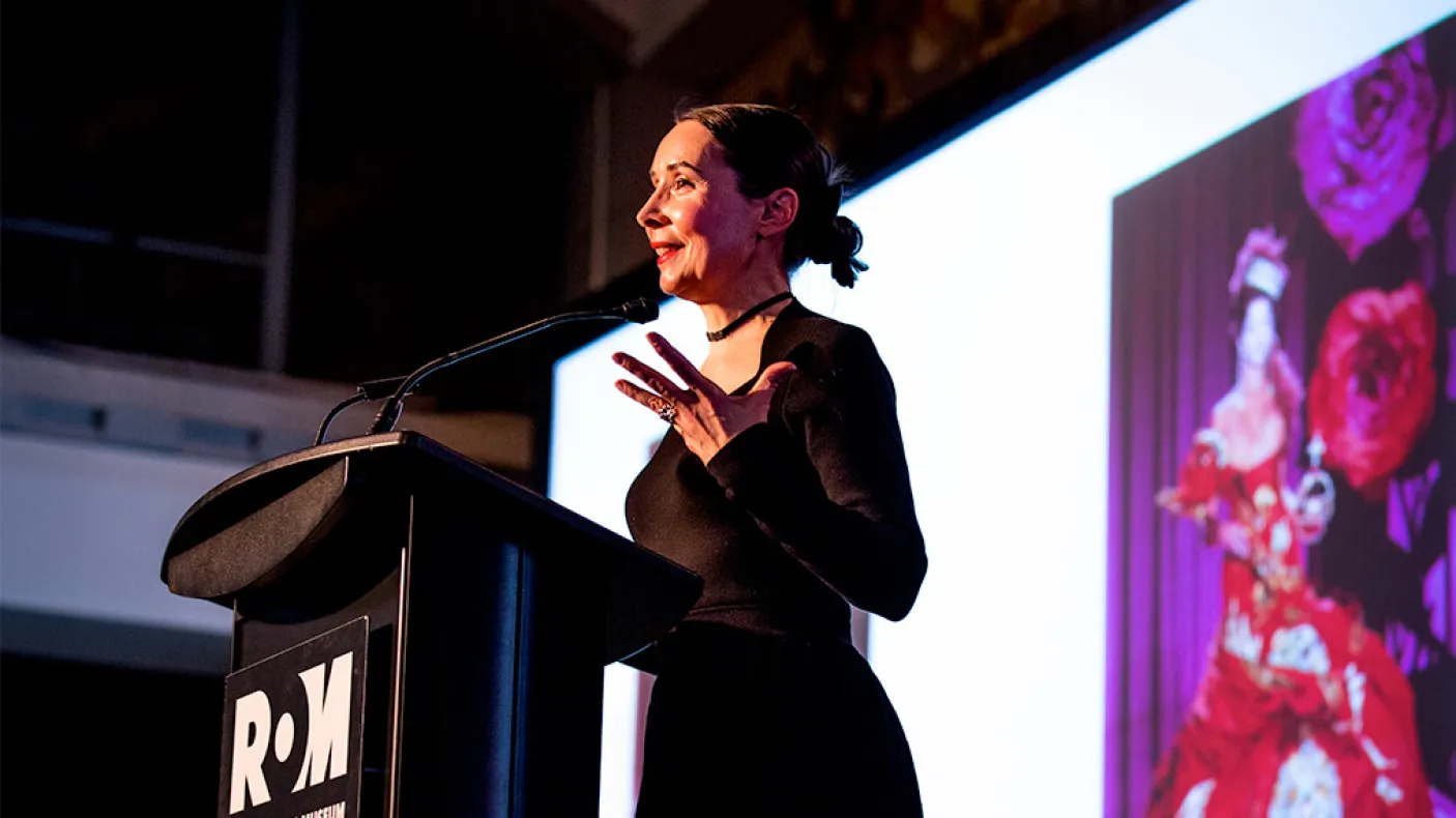 Woman speaking on stage
