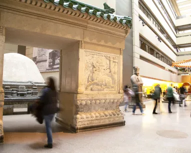  A large building filled with people engaged in various activities inside.