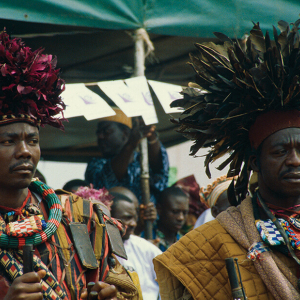 Warriors wearing ceremonial feather headdresses.