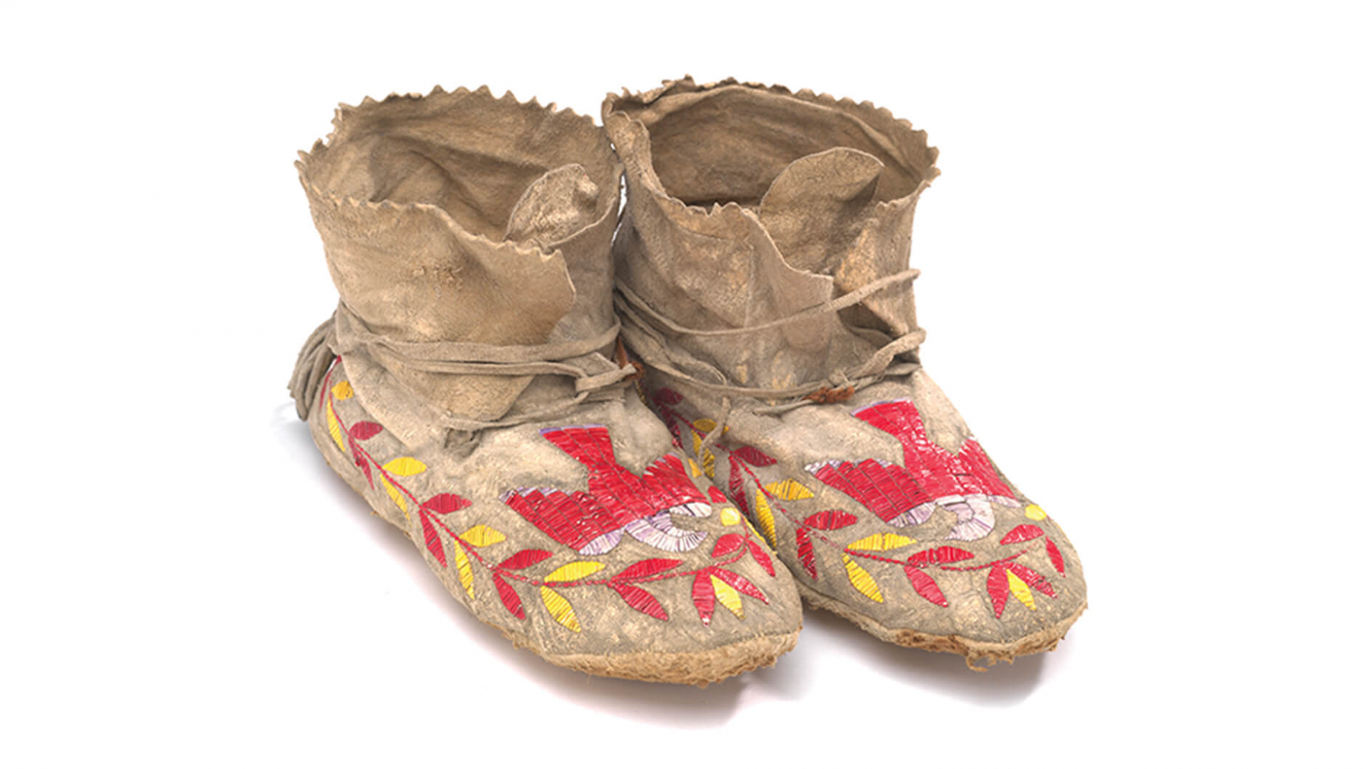 Moccasins with quilled Thunderbird; hide decorated with dyed porcupine quills.