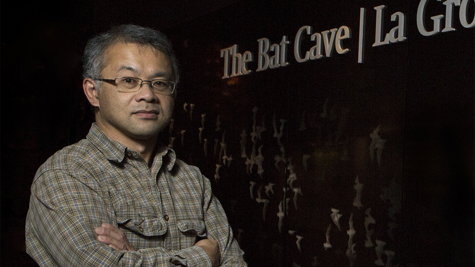 Burton Lim standing in front of the Bat Cave at the ROM