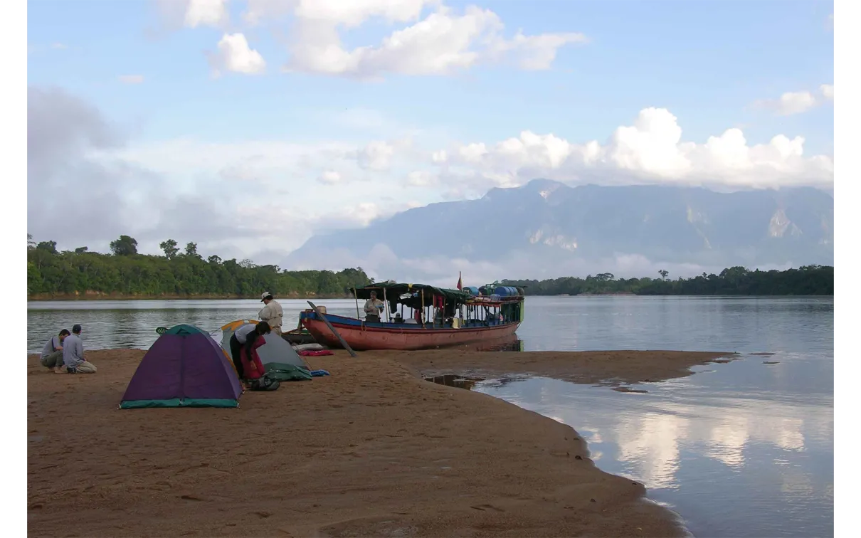 The 2005 Venezuela expedition B-team sets up camp on an upper Orinoco River beach in the shadow of Cerro Duida.