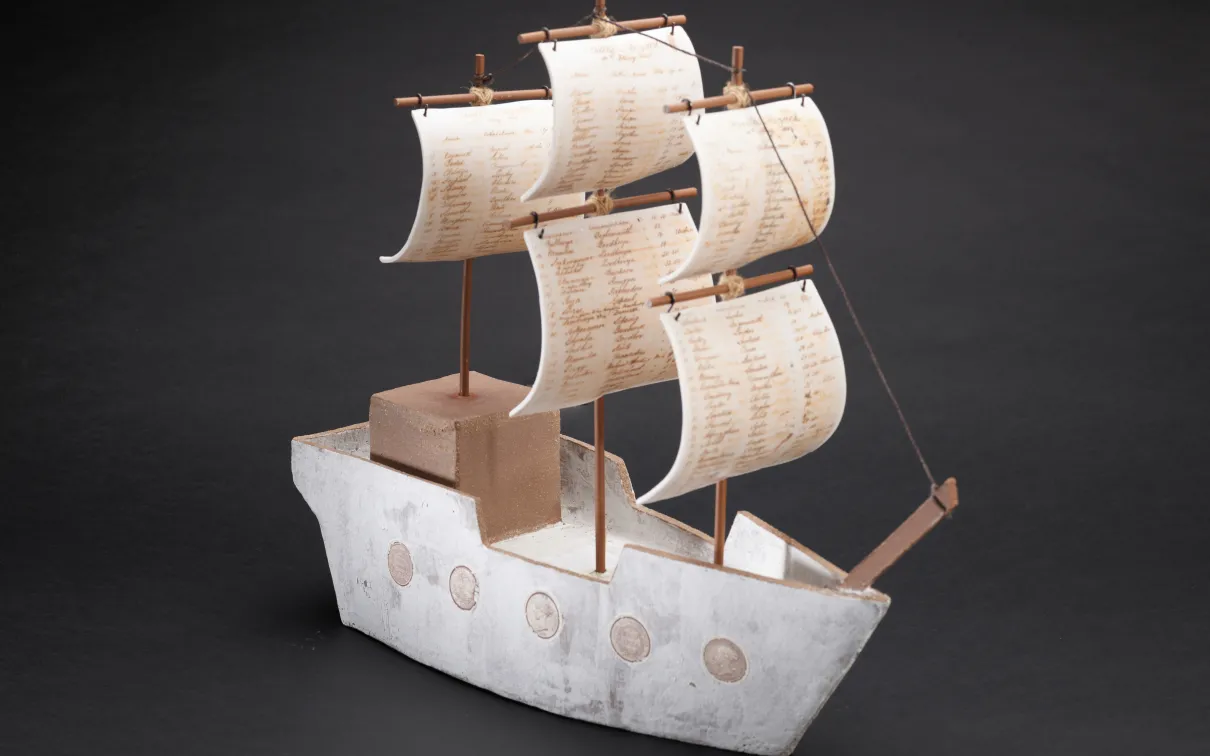 Porcelain boat with writing on the sails