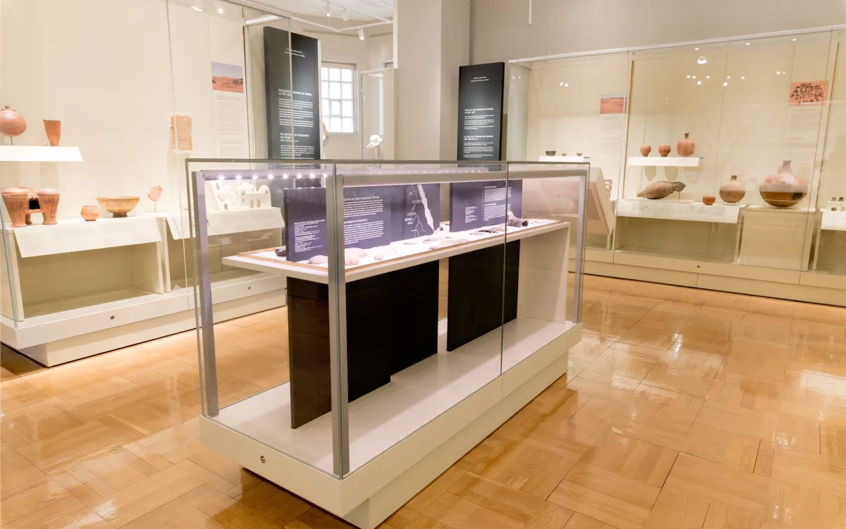 A gallery displaying a collection of African objects including pottery.