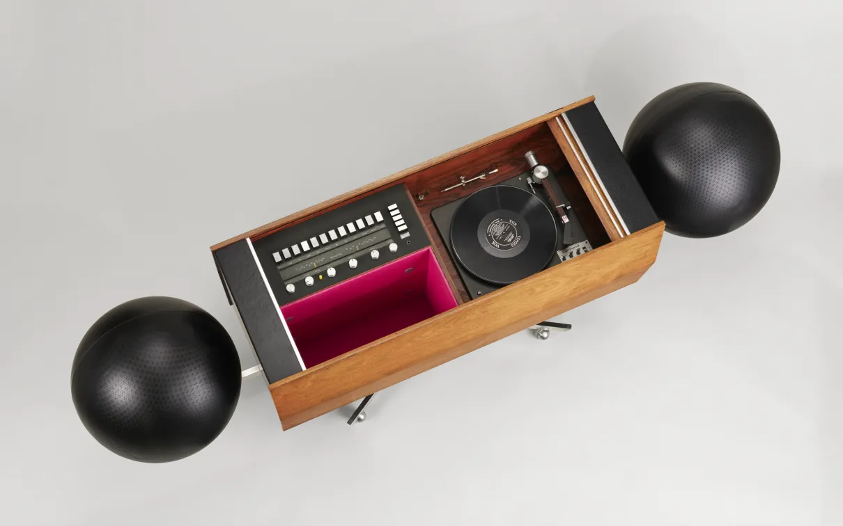 A wooden stereo system featuring a record player and two speakers, showcasing a classic and elegant design.