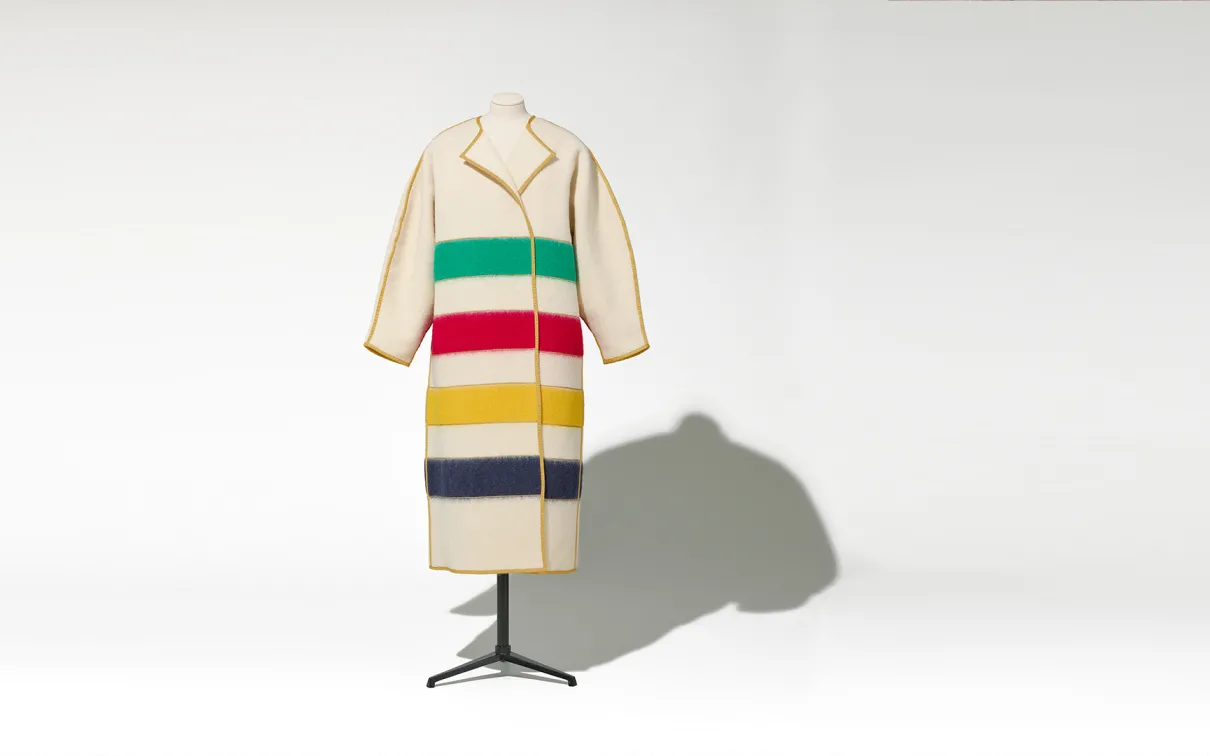 A coat featuring vibrant multicolored stripes, showcasing a stylish and eye-catching design.