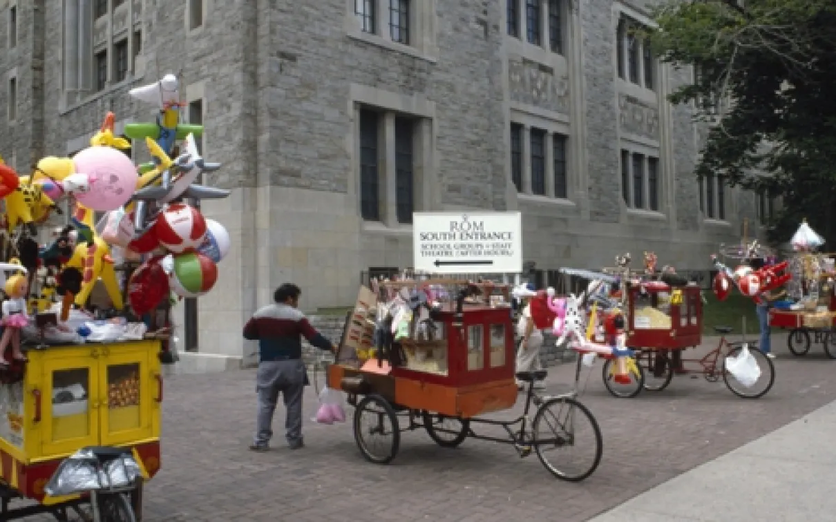 A popcorn cart in the middle of the street.