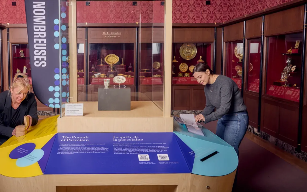 Two people interacting with a connection station