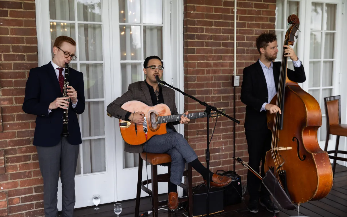 3 gentlemen playing musical instruments 