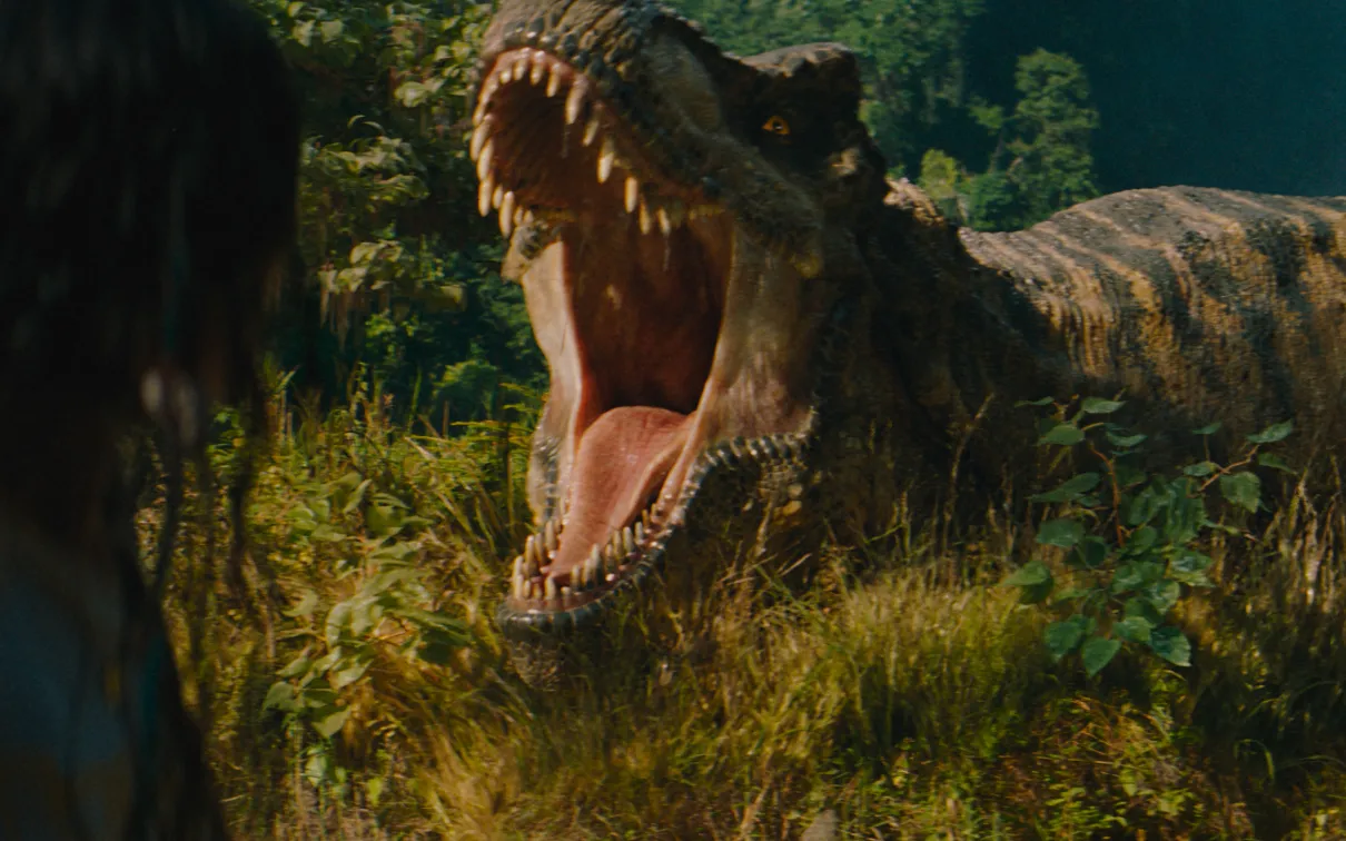 Woman looks behind her to see a giant dinosaur